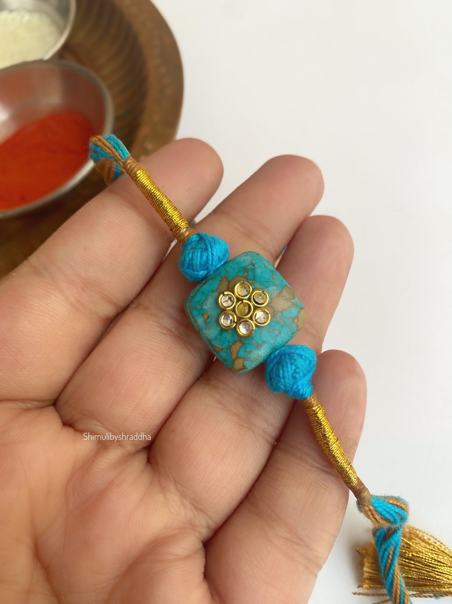 Natural stone rakhi with kundan work