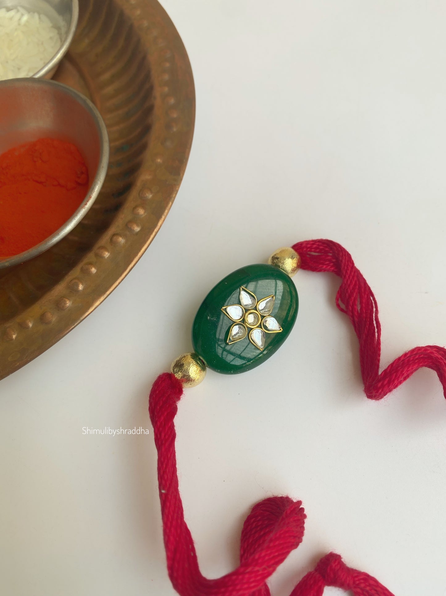 Natural stone rakhi with kundan work