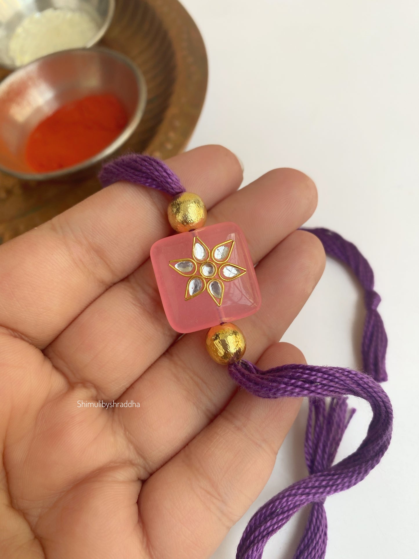 Natural stone rakhi with kundan work